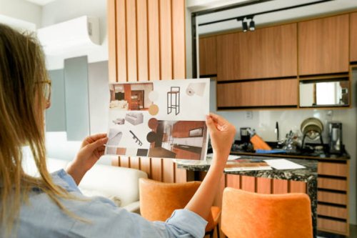 female architect looking at the picture of interior design - home decoration stock pictures, royalty-free photos & images