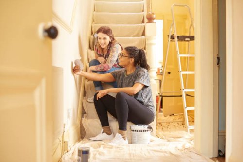 female couple choosing swatch colours - home decoration stock pictures, royalty-free photos & images