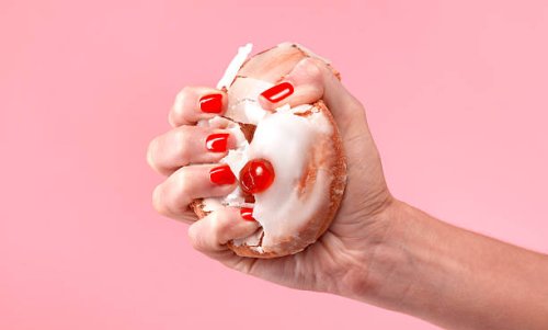 female dieter crushing belgian bun - junk food stock pictures, royalty-free photos & images