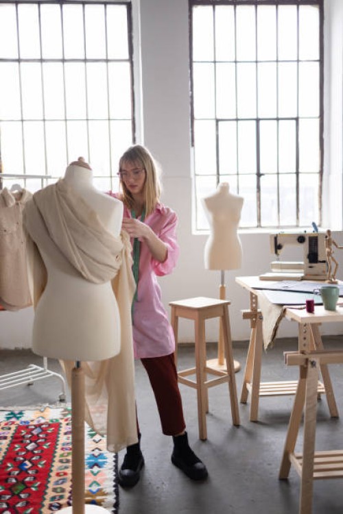 female fashion designer putting her creativity to work - fashion stock pictures, royalty-free photos & images