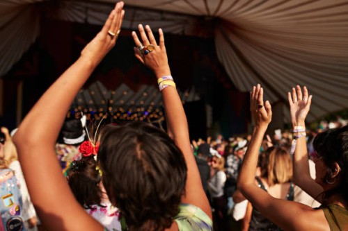female friends dancing with arms raised at concert - concert stock pictures, royalty-free photos & images