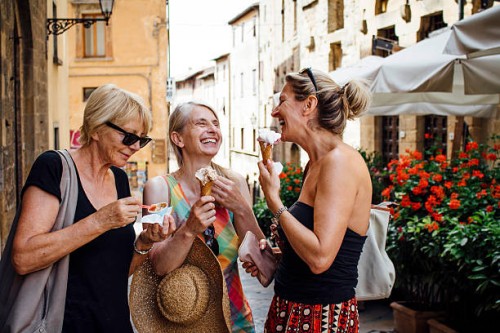 female friends enjoying italian ice-cream - food stock pictures, royalty-free photos & images