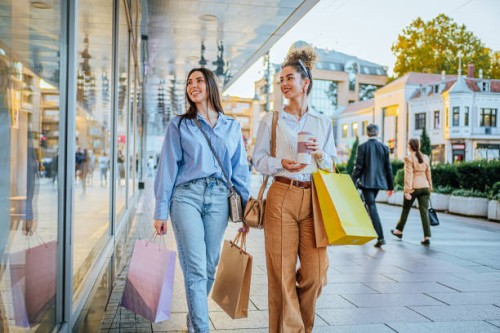 female friends looking at store window - fashion stock pictures, royalty-free photos & images