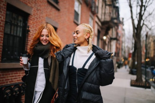 female friends talking on the street in west village, manhattan, ny - fashion stock pictures, royalty-free photos & images