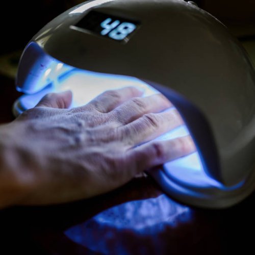 female hand in the lamp for manicure - nails art stock pictures, royalty-free photos & images