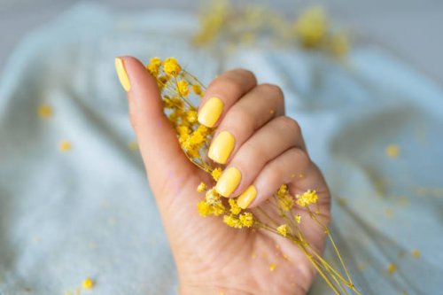 female hand with stylish colorful nails, on bright background - nails art stock pictures, royalty-free photos & images