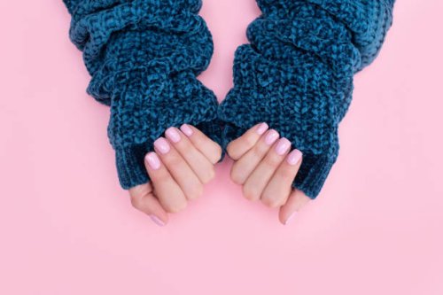 female hands manicure close up view on pink knitted sweater background. nail painting effects. manicure salon banner concept - nails art stock pictures, royalty-free photos & images