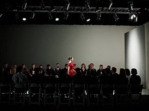 female model walking alone on catwalk - fashion week stock pictures, royalty-free photos & images