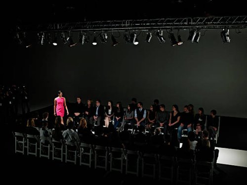 female model walking down catwalk at fashion show - fashion week stock pictures, royalty-free photos & images