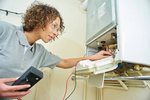 female plumber with central heating - home decoration stock pictures, royalty-free photos & images