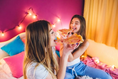 female slumber party - junk food stock pictures, royalty-free photos & images