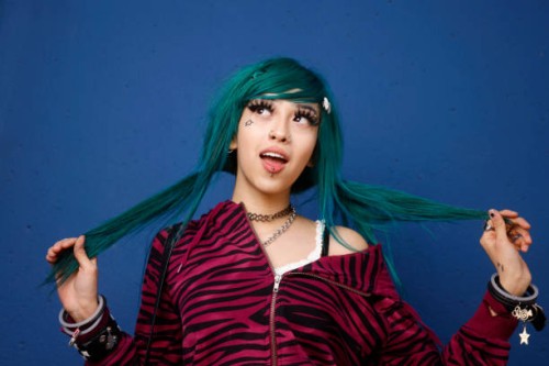 female with green hair pulling on her ponytails - fashion stock pictures, royalty-free photos & images