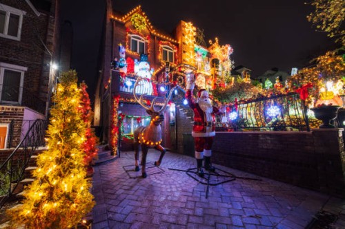 festive christmas decorated houses illuminated at night in brooklyn, new york - garden decoration stock pictures, royalty-free photos & images