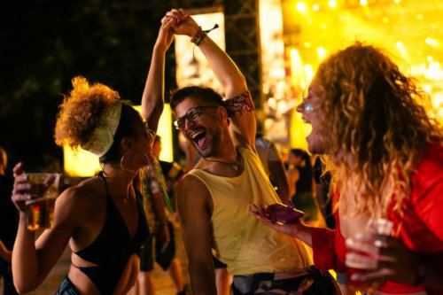 festive friends enjoy at concert - concert stock pictures, royalty-free photos & images