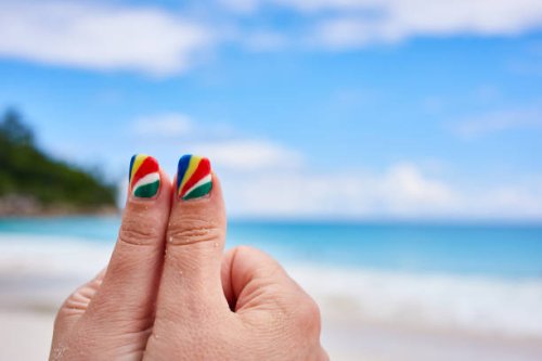 Finger nail art and design with the colours of the national flag on May 4, 2017 in Praslin, Seychelles.