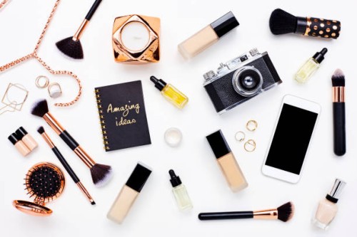 flat lay of beauty products on bloggers desk - fashion stock pictures, royalty-free photos & images