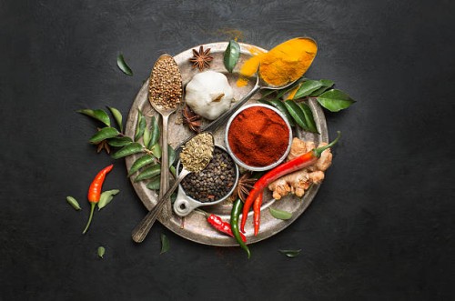 flat lay overhead view herb and spices on textured black background. - food stock pictures, royalty-free photos & images