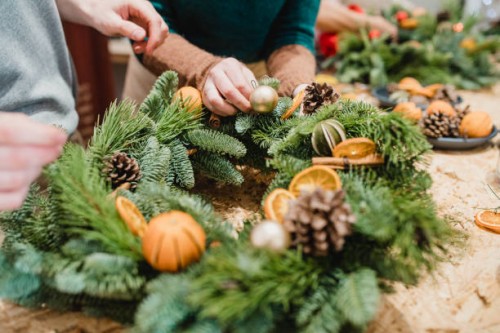 florists designing a christmas wreath - home decoration stock pictures, royalty-free photos & images