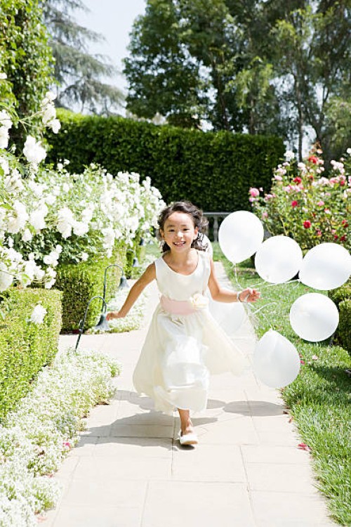 flower girl with balloons - garden decoration stock pictures, royalty-free photos & images