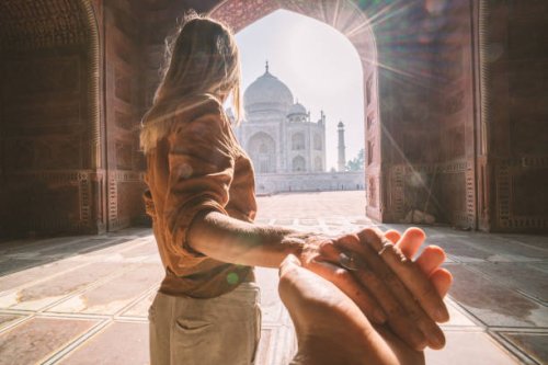 follow me to the taj mahal, india. female tourist leading boyfriend to there magnificent famous mausoleum in agra. people travel concept - travel stock pictures, royalty-free photos & images