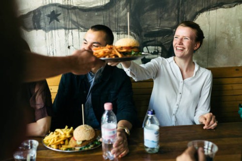 food being served to customers in burger restaurant - food stock pictures, royalty-free photos & images