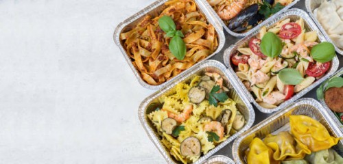 food delivery. different aluminium lunch box with healthy natural chinese food dumplings, noodles with chicken, rice with chicken, pasta with salmon, falafel. airlines food. airline meals and snacks. takeaway food. - junk fo