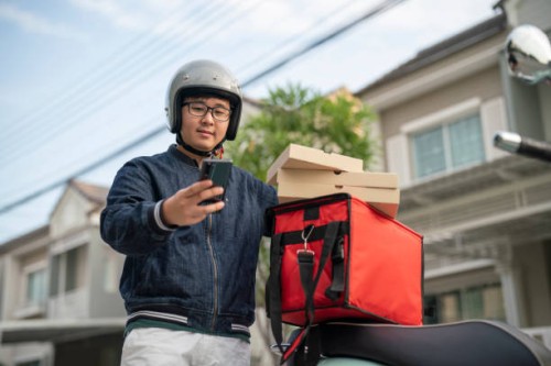 food delivery man getting ready for work - junk food stock pictures, royalty-free photos & images
