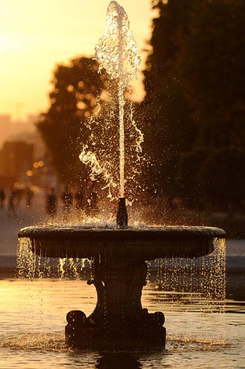 fountain in sunset - garden decoration stock pictures, royalty-free photos & images
