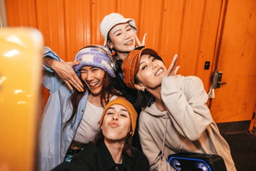 four female friends taking a selfie - fashion stock pictures, royalty-free photos & images