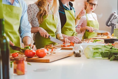 four people taking part in cooking class - food stock pictures, royalty-free photos & images