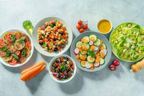 fresh and healthy salad plates shot from above - food stock pictures, royalty-free photos & images