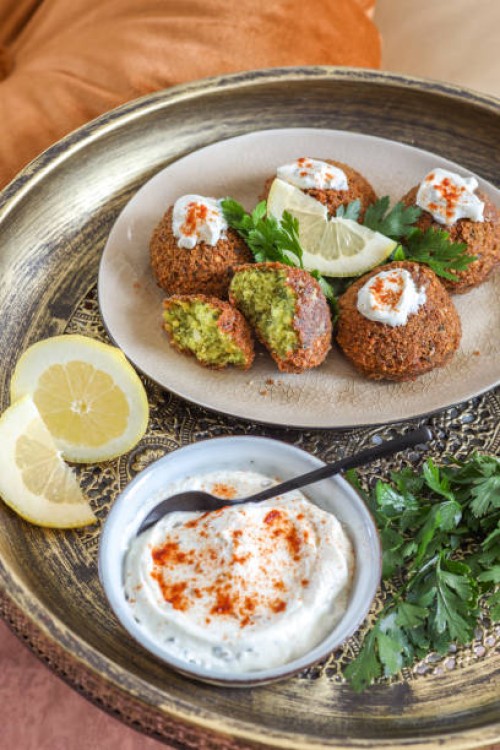 fresh falafel with lemon and yogurt dip - food stock pictures, royalty-free photos & images