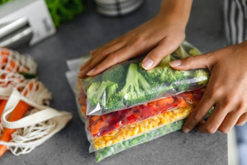 fresh ripe vegetables in plastic bags - food stock pictures, royalty-free photos & images