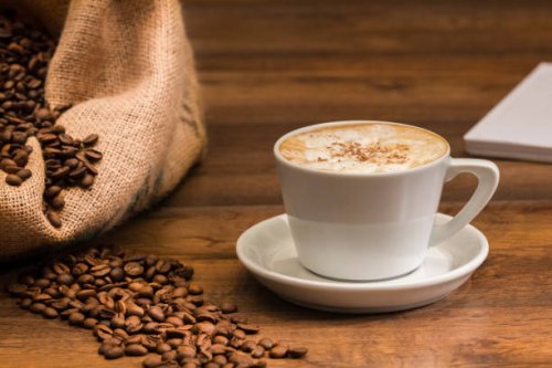 freshly brewed cup of coffee with beans - coffee stock pictures, royalty-free photos & images