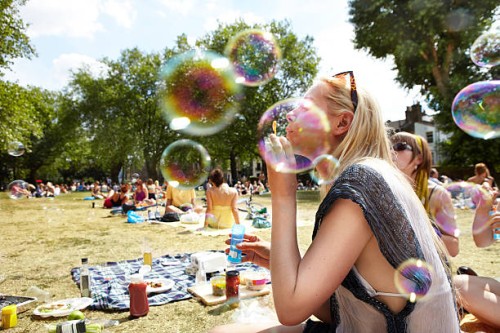 friends blowing bubbles in the park - food stock pictures, royalty-free photos & images