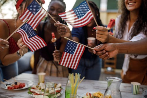 friends dancing and waving american flags during a 4th of july party - food stockfoto's en -beelden