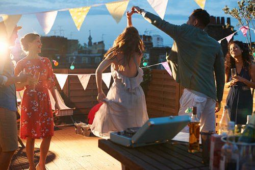friends dancing at early evening party - garden decoration stock pictures, royalty-free photos & images
