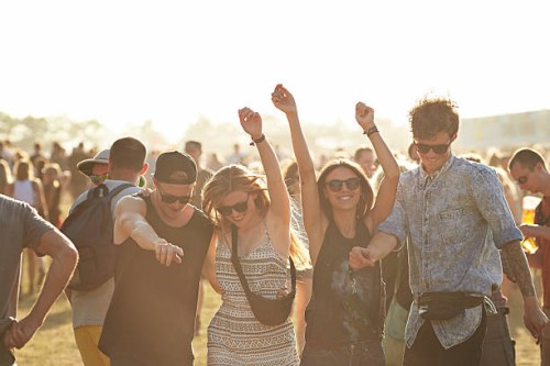 friends dancing at outside concert - concert stock pictures, royalty-free photos & images