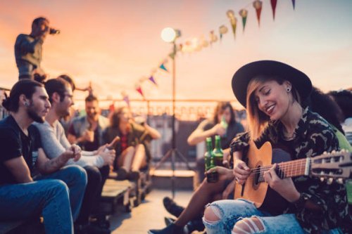 friends drinking and partying on the rooftop - concert stock pictures, royalty-free photos & images