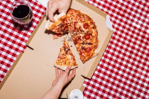 friends eating pizza at home - food stock pictures, royalty-free photos & images