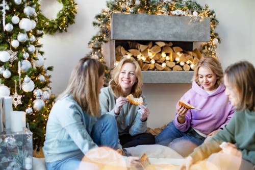 friends eating pizza for christmas - junk food stock pictures, royalty-free photos & images