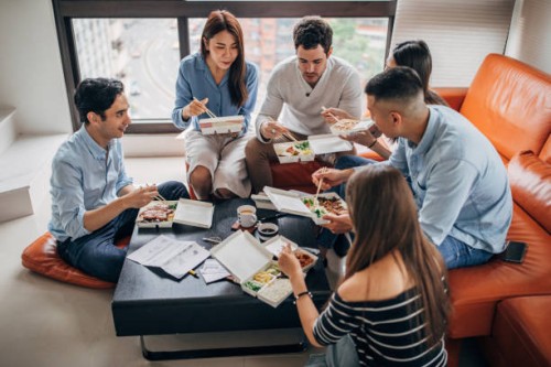 friends eating takeaway food - junk food stock pictures, royalty-free photos & images
