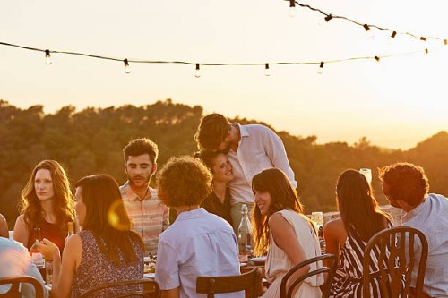 friends enjoying at dinner party - food stock pictures, royalty-free photos & images