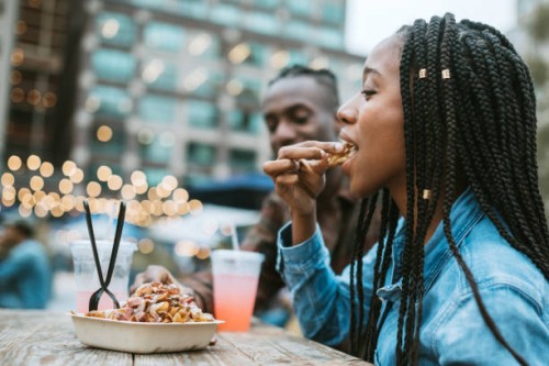 friends enjoying food truck life in new york - food stock pictures, royalty-free photos & images