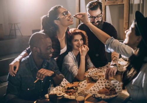 friends enjoying their favorite food place - junk food stock pictures, royalty-free photos & images