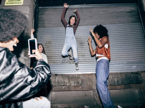 friends filming to share on social media at a party - fashion stock pictures, royalty-free photos & images