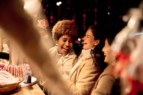 friends having fun in a food street market at night - junk food stock pictures, royalty-free photos & images