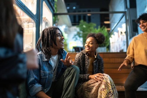 friends having fun outdoors at night - fashion stock pictures, royalty-free photos & images