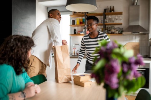 friends having lunch at home - junk food stock pictures, royalty-free photos & images