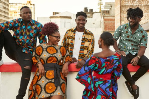 friends in colorful clothes on roof terrace in the city, maputo, mozambique - fashion stock pictures, royalty-free photos & images